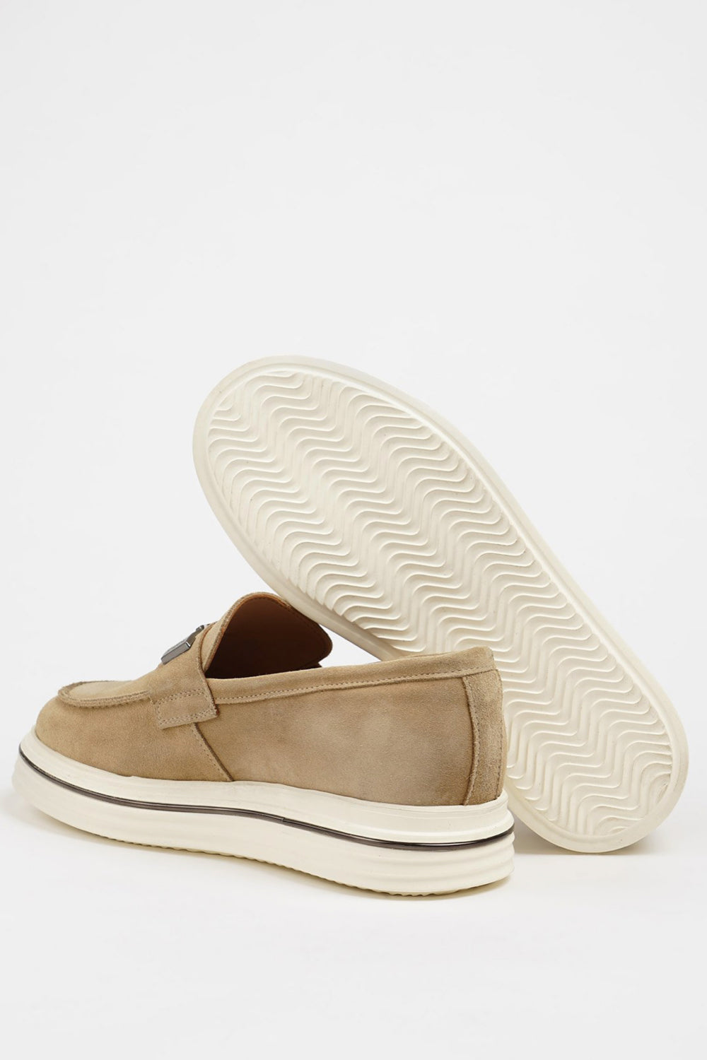 Casual beige suede loafers by Mazonni with decorative buckle and thick white sole