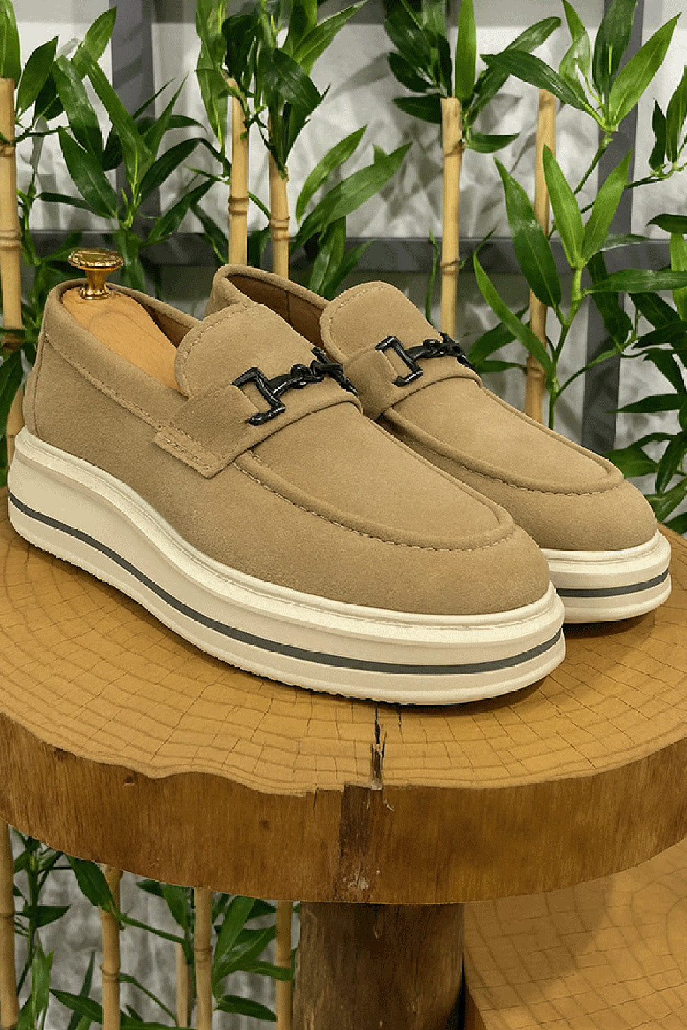 Beige suede loafers for men by Mazonni with metal buckle and chunky white platform sole