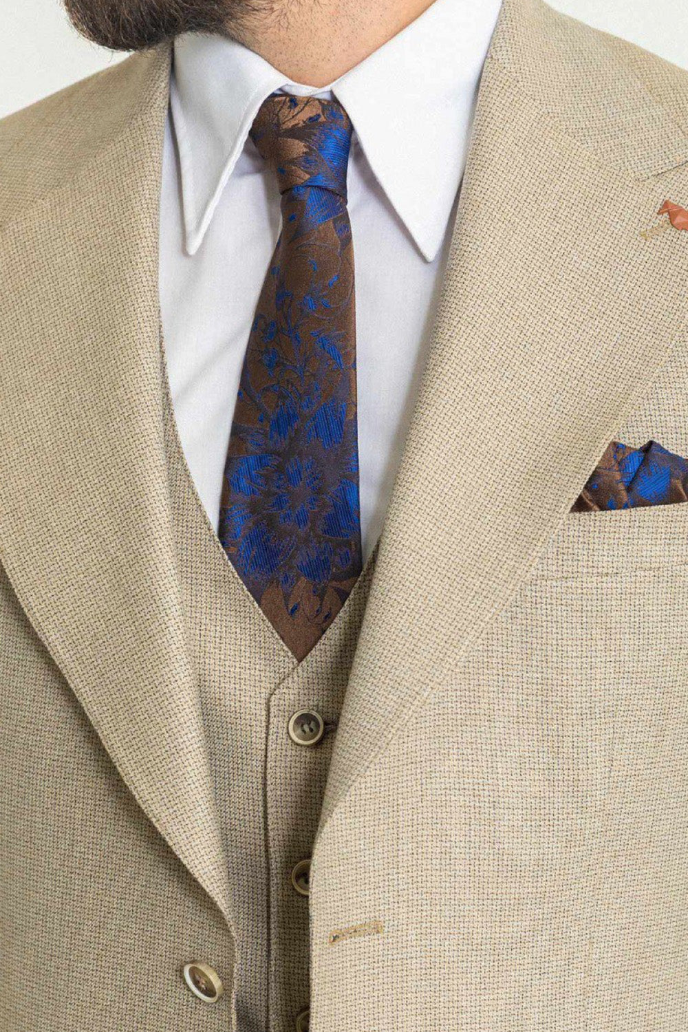 Mazonni men's beige suit featuring a modern cut and structured design with vest and accessories