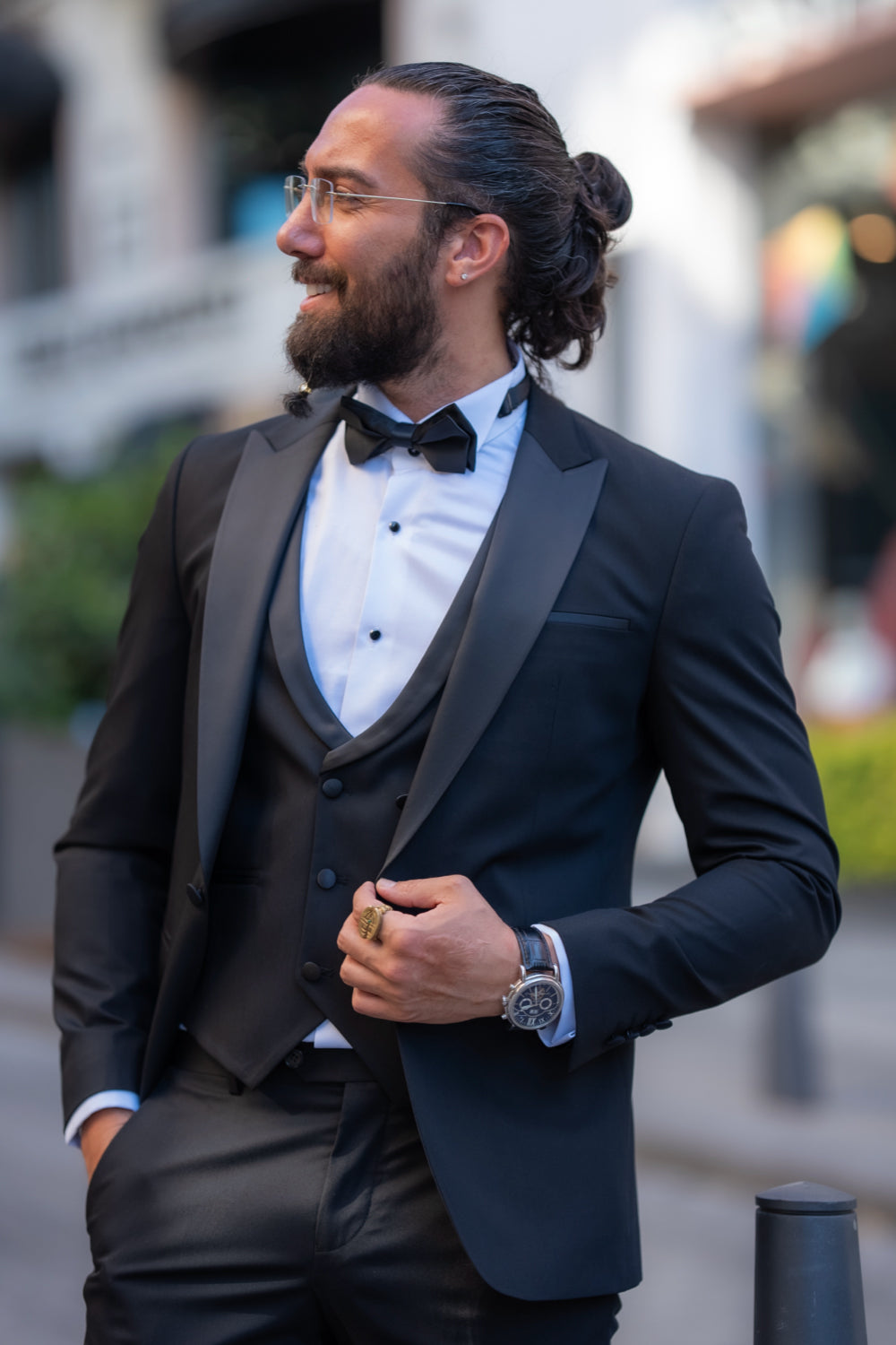 Mazonni men's black suit with fitted blazer, stylish bow tie and modern tailoring