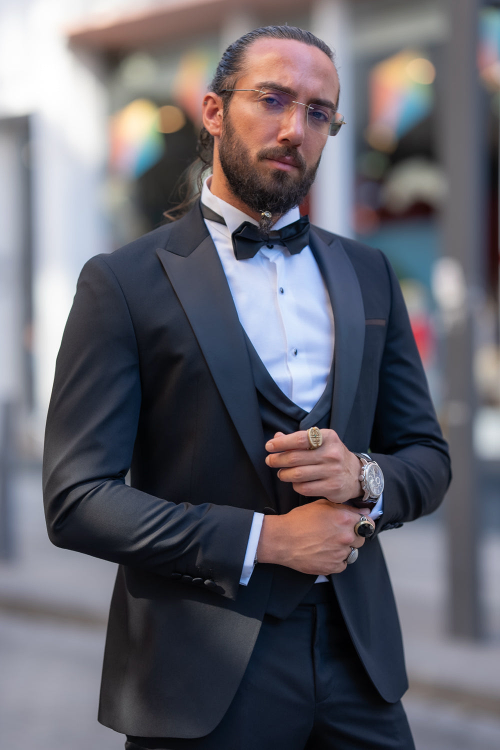 Black formal suit with vest and bow tie by Mazonni, ideal for sophisticated occasions