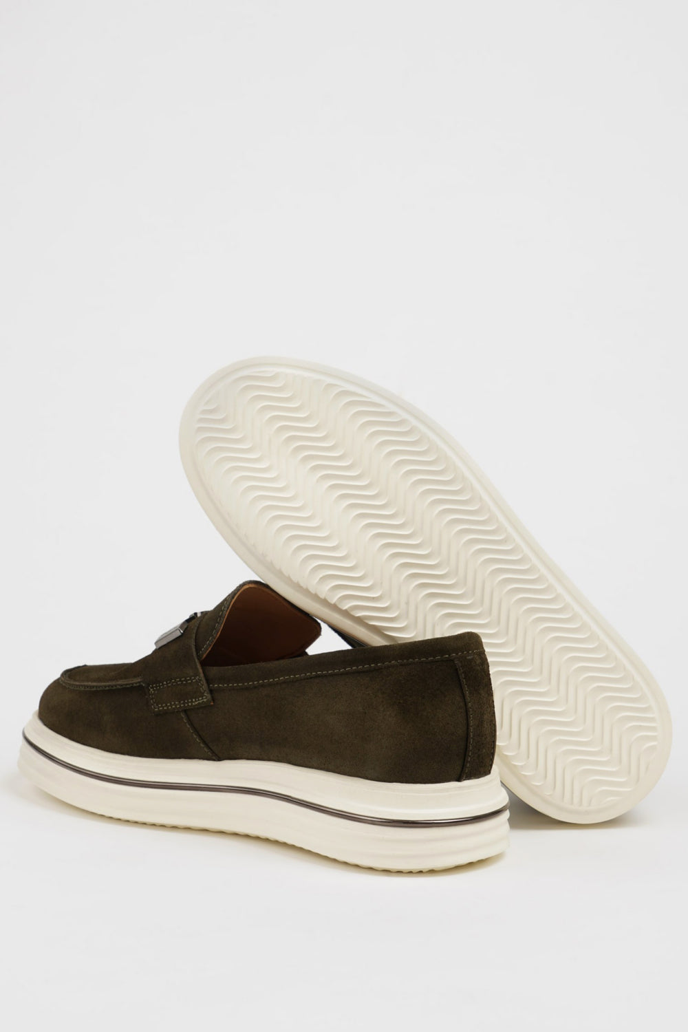 Stylish olive suede loafers by Mazonni with decorative buckle detail and sporty silhouette