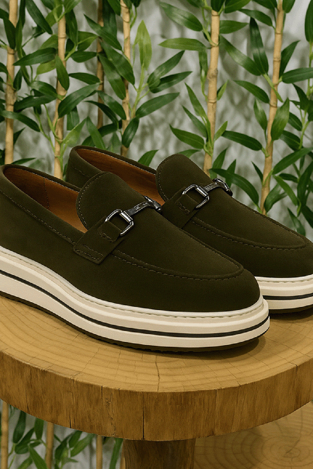 Olive green suede loafers for men by Mazonni with metal buckle and chunky white sole