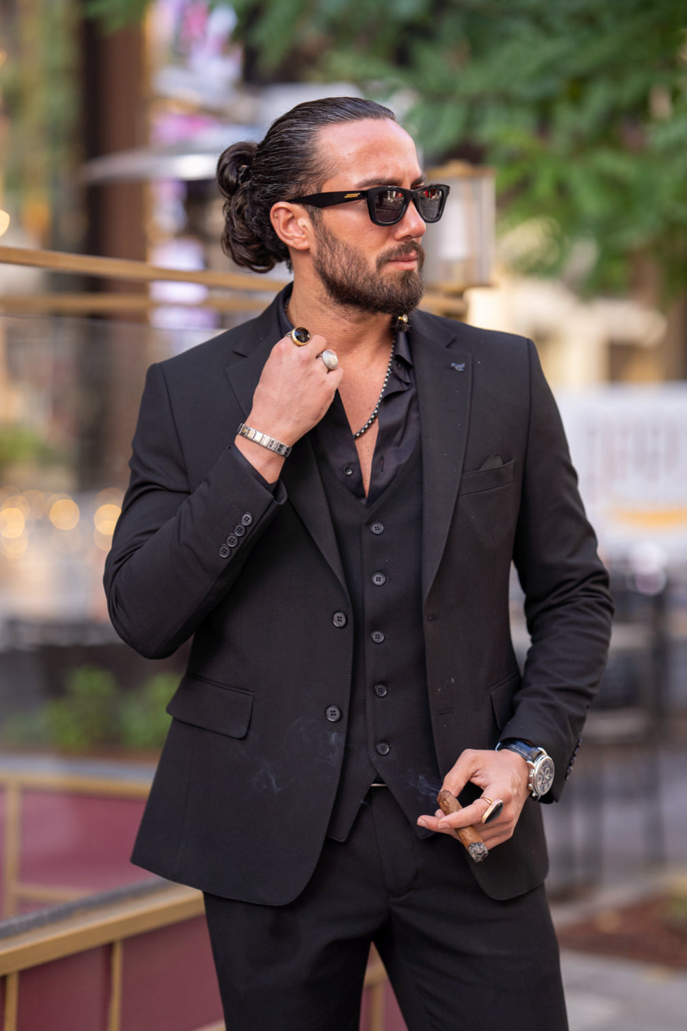 Relaxed black suit set for men from Mazonni featuring peak lapel blazer and fitted pants for confident street elegance