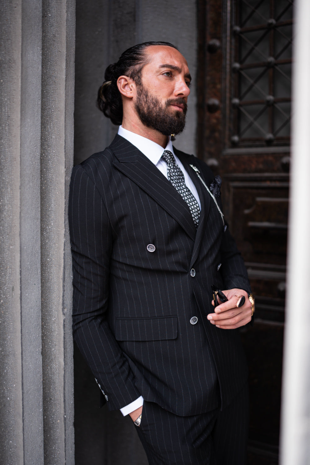 Tailored black suit from Mazonni with pinstripes, perfect for corporate events and sharp city style