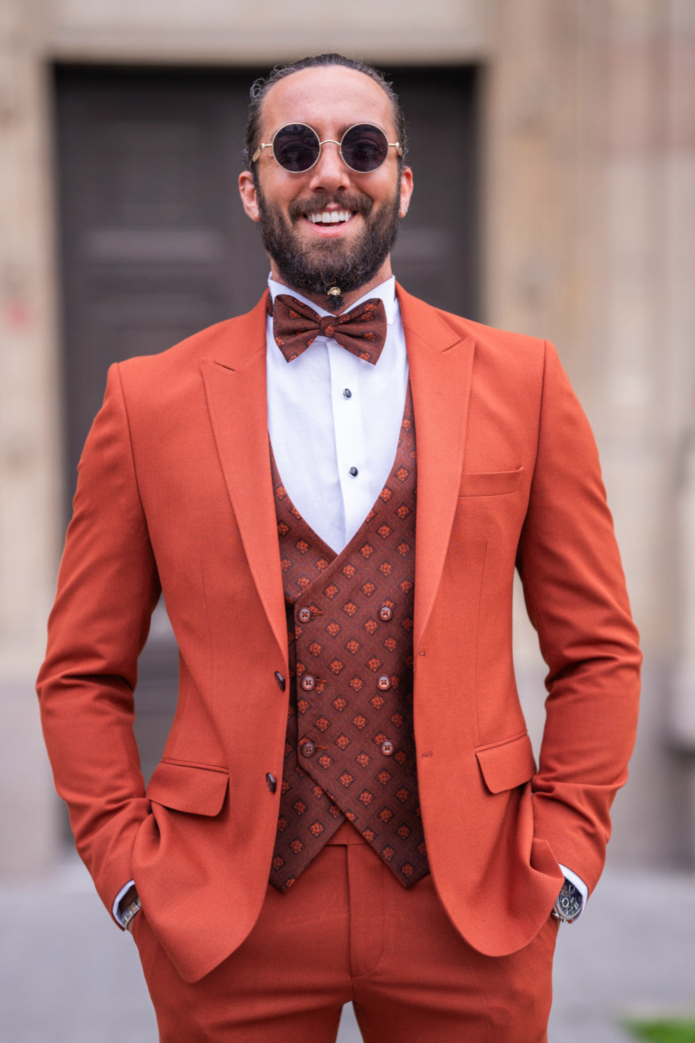 Mazonni classic orange groom suit with slim fit trousers and brown vest for standout formal occasions