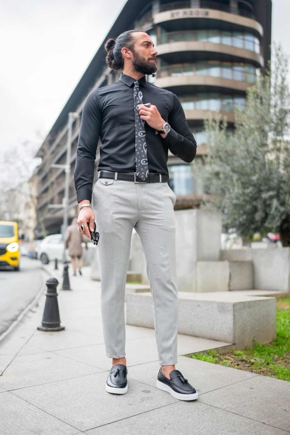 Light grey dress pants for men by Mazonni styled with black shirt for smart casual look