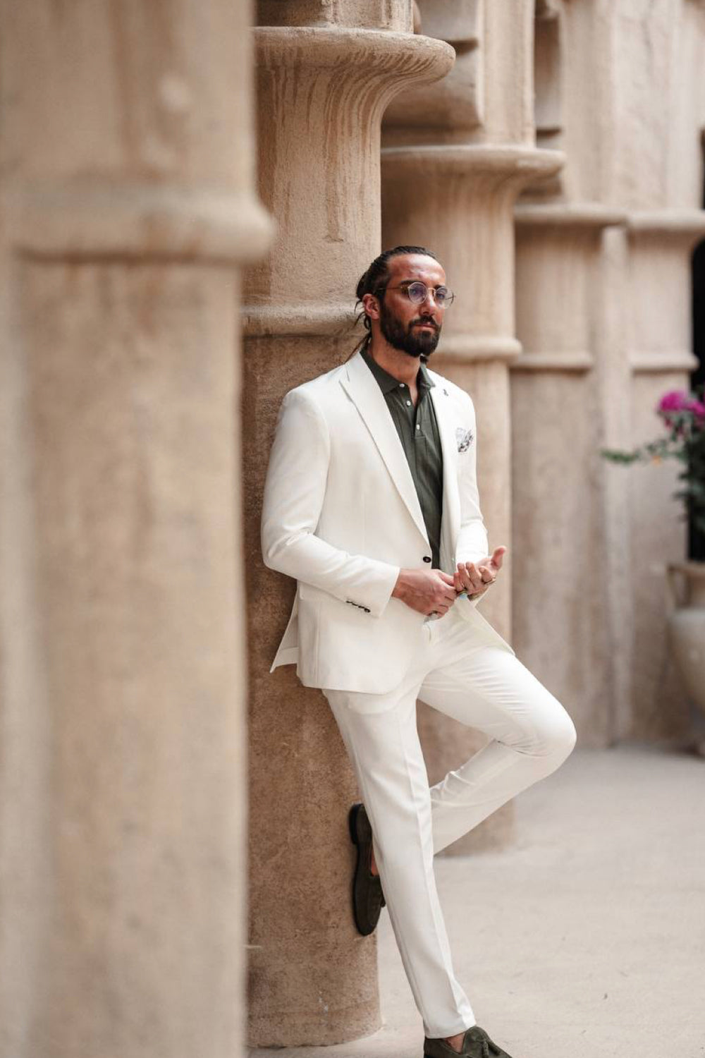 Modern white Mazonni suit combined with olive dress shirt and brown accessories, a bold choice for stylish men
