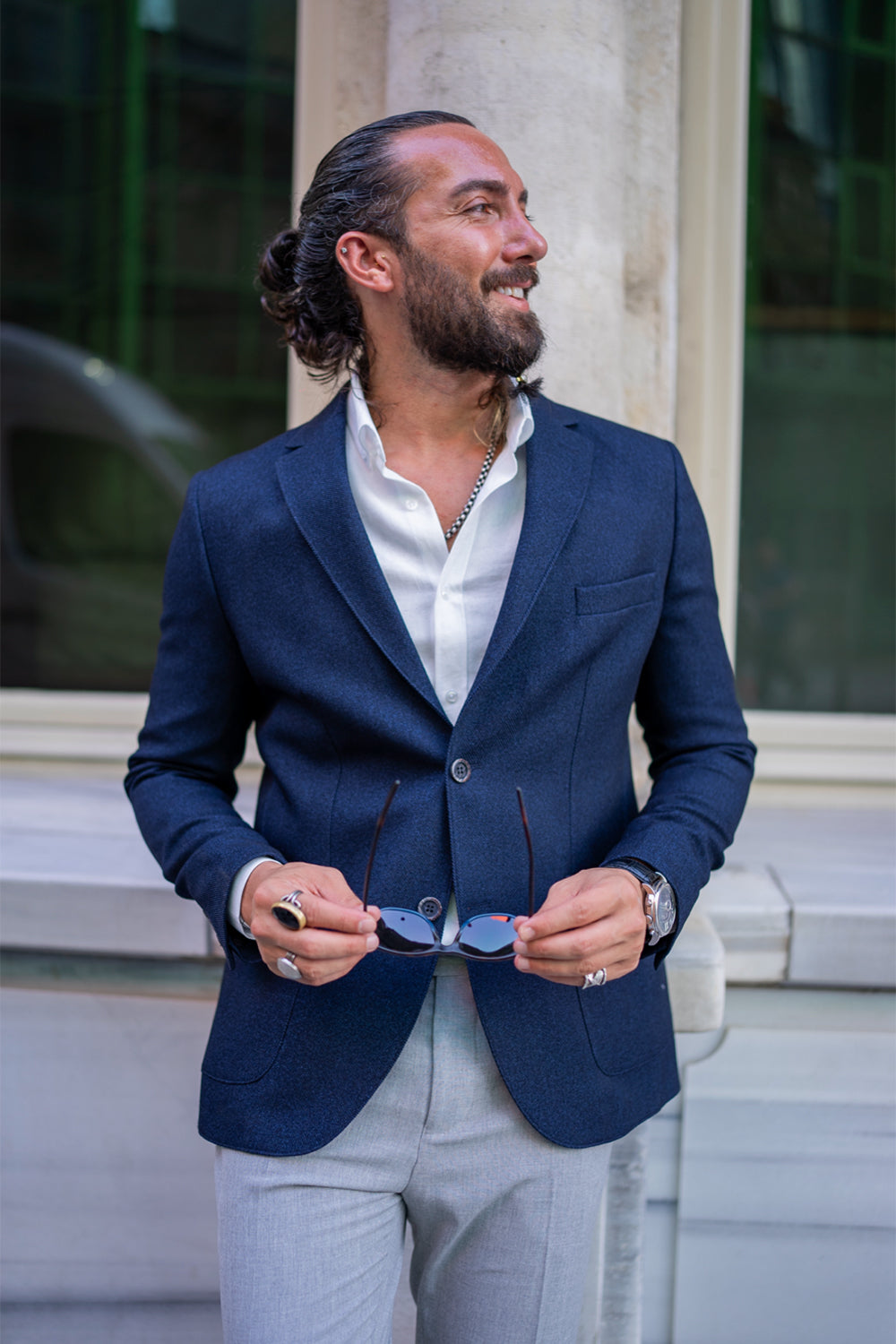 classic navy Mazonni blazer paired with grey pants and loafers, refined urban outfit for summer