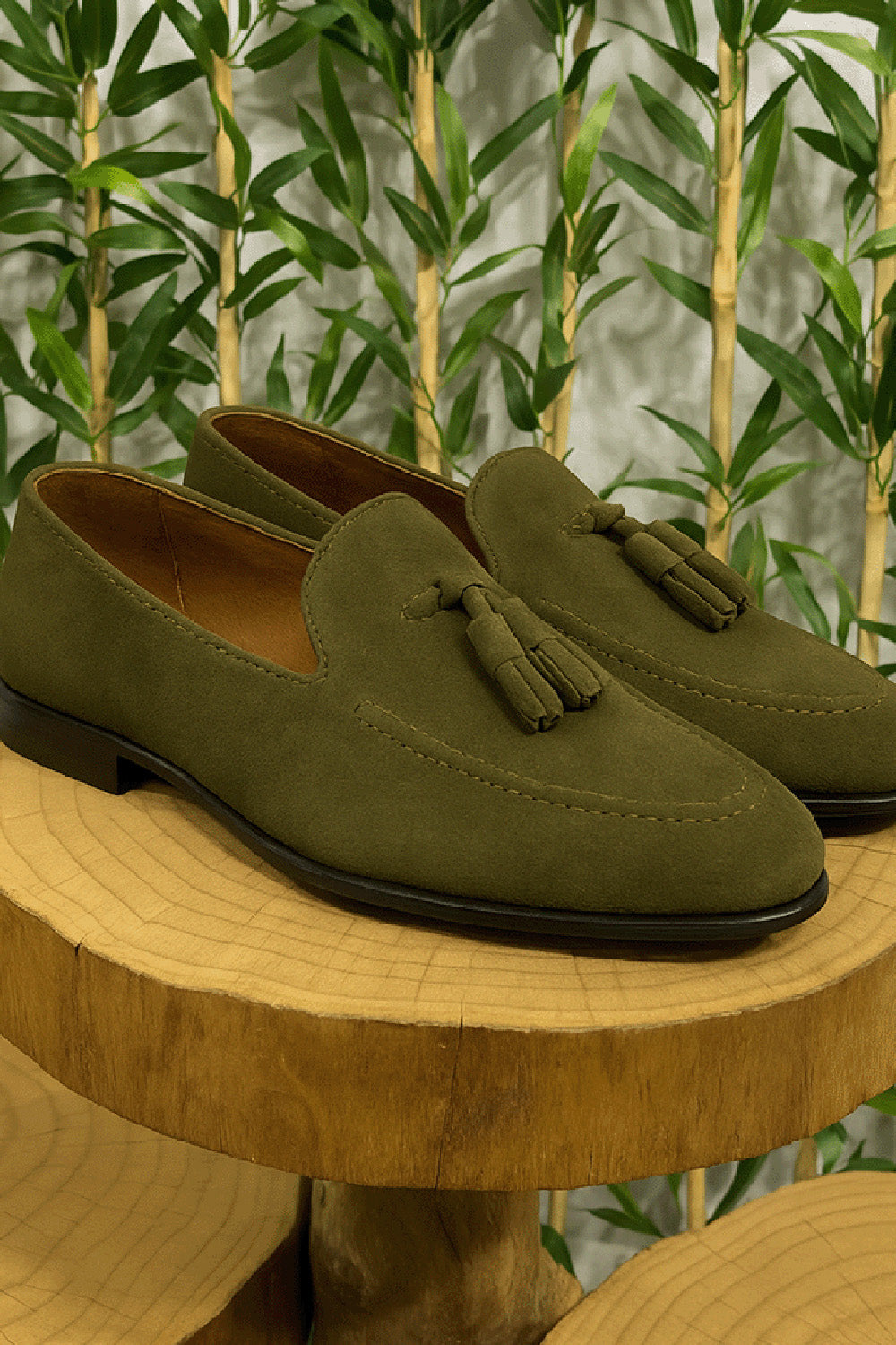 Olive green suede tassel loafers for men by Mazonni with classic design and stitched detailing
