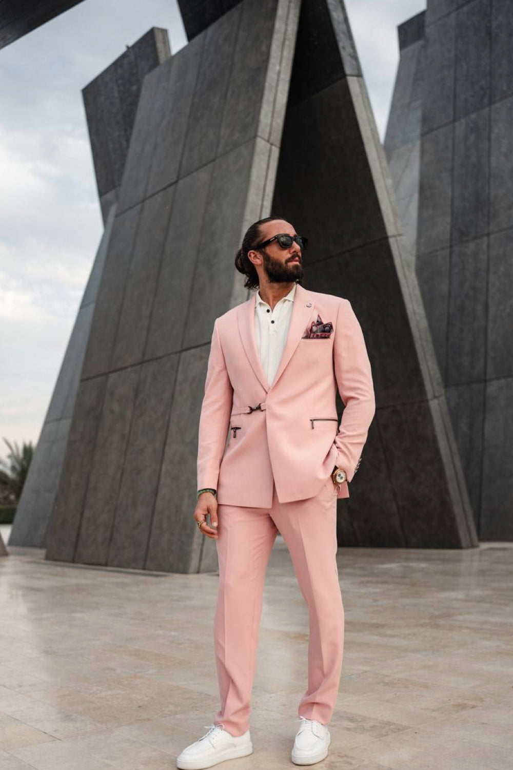 Light pink Mazonni men's suit styled with a white shirt and white sneakers, perfect for weddings or creative business looks