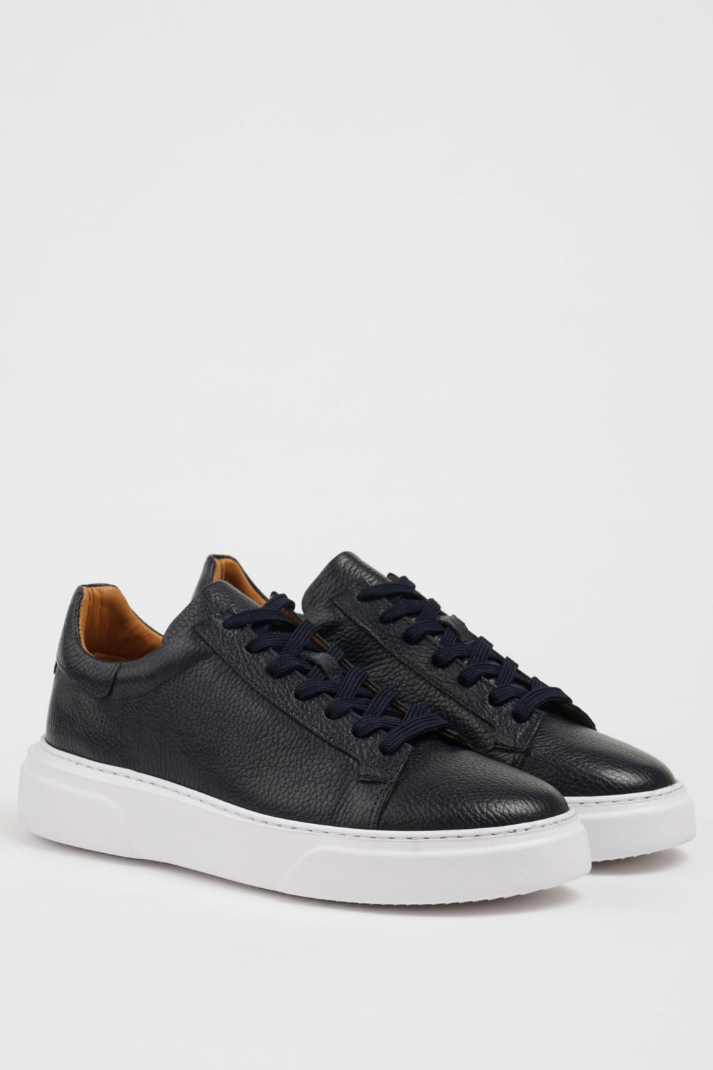 Mazonni men’s dark blue low-top trainers featuring pebbled leather texture and cushioned sole
