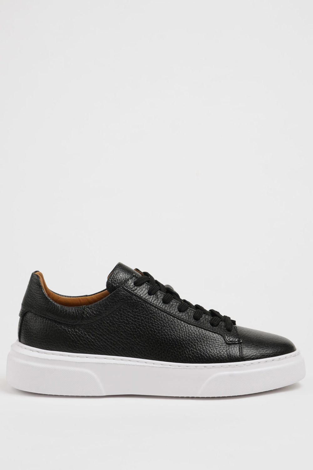 Men’s black lace-up sneakers by Mazonni with soft leather upper and thick white rubber sole