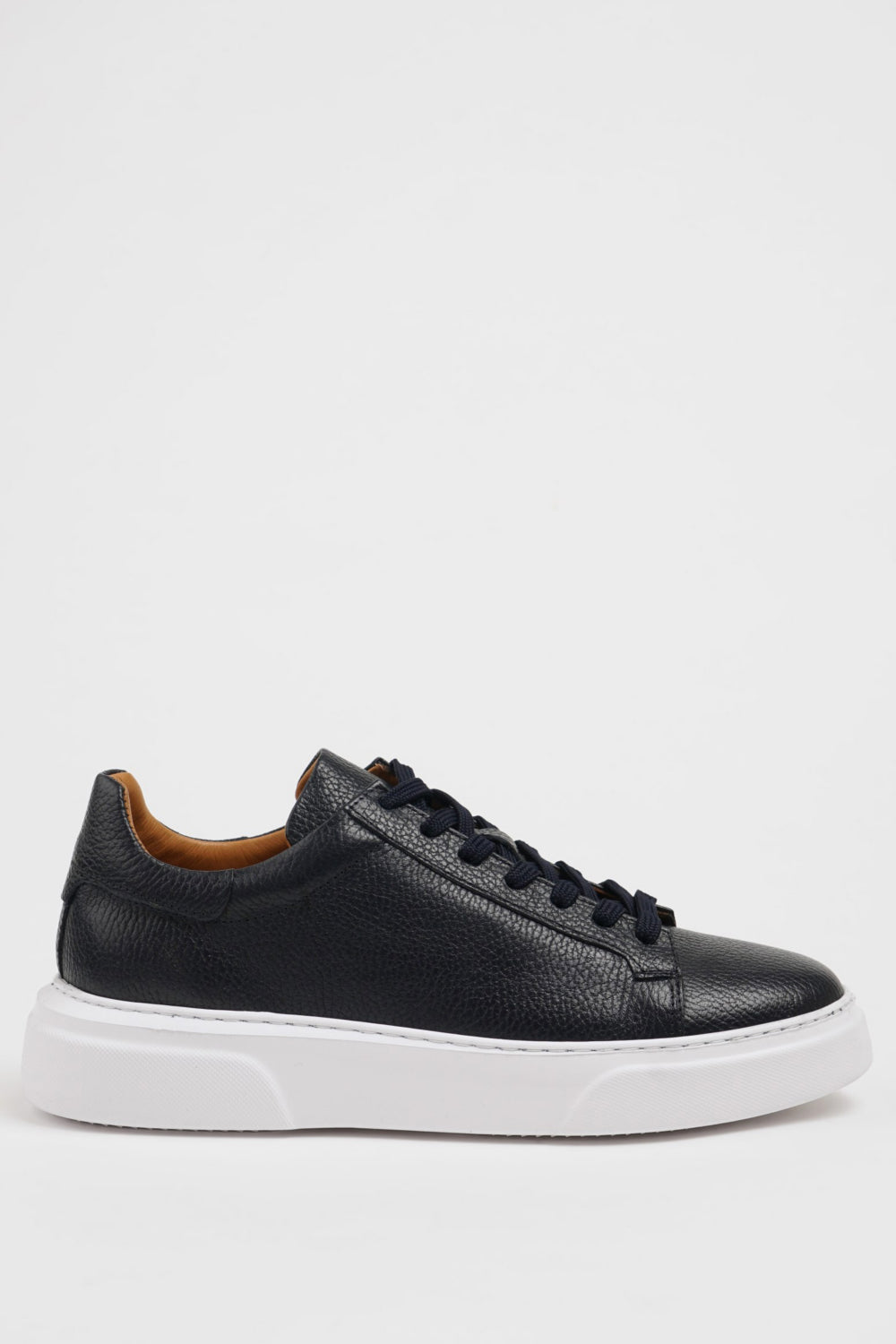 Men’s navy leather shoes by Mazonni with lace-up closure and chunky white rubber outsole