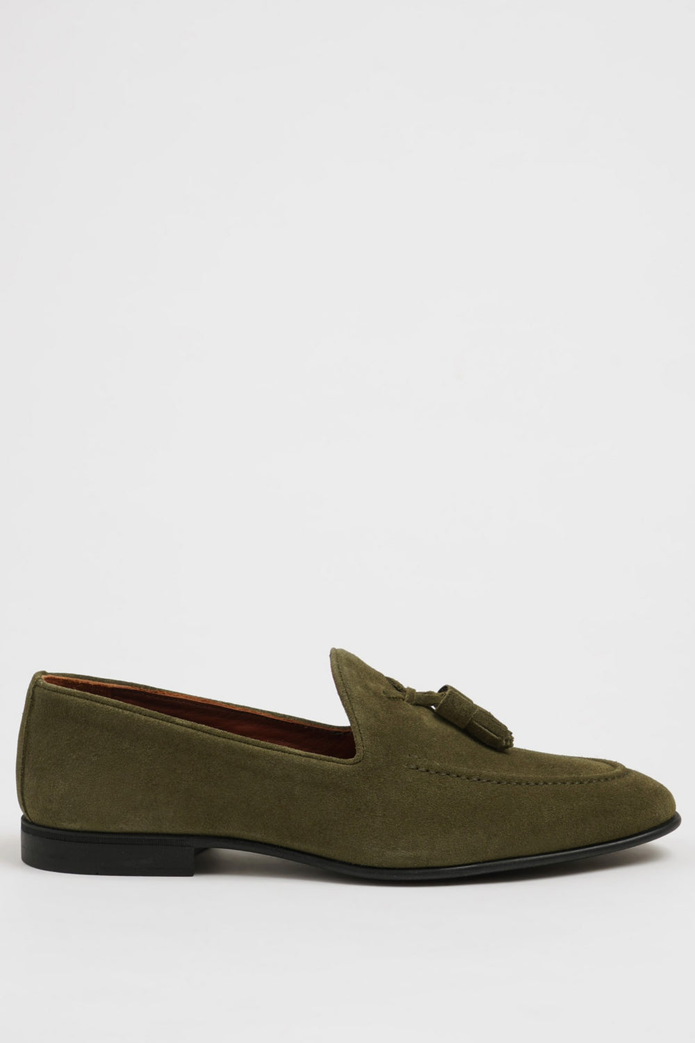 Men’s green suede dress loafers from Mazonni featuring tassel accents and soft leather lining