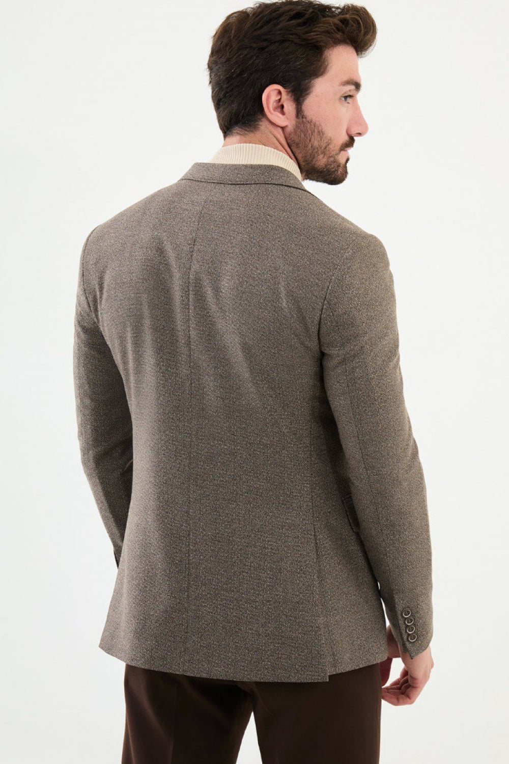 Rear view of light brown textured blazer by Mazonni showing tailored silhouette – versatile men’s blazer for office or evening style