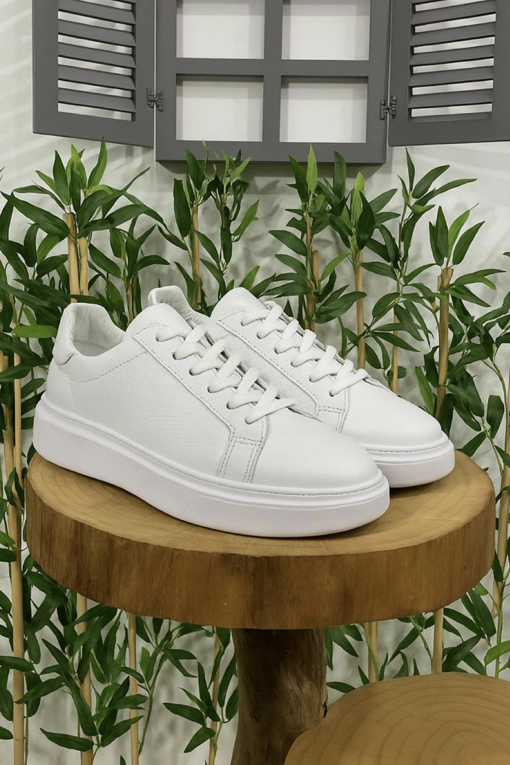 White leather sneakers for men by Mazonni with minimalist design and thick sole