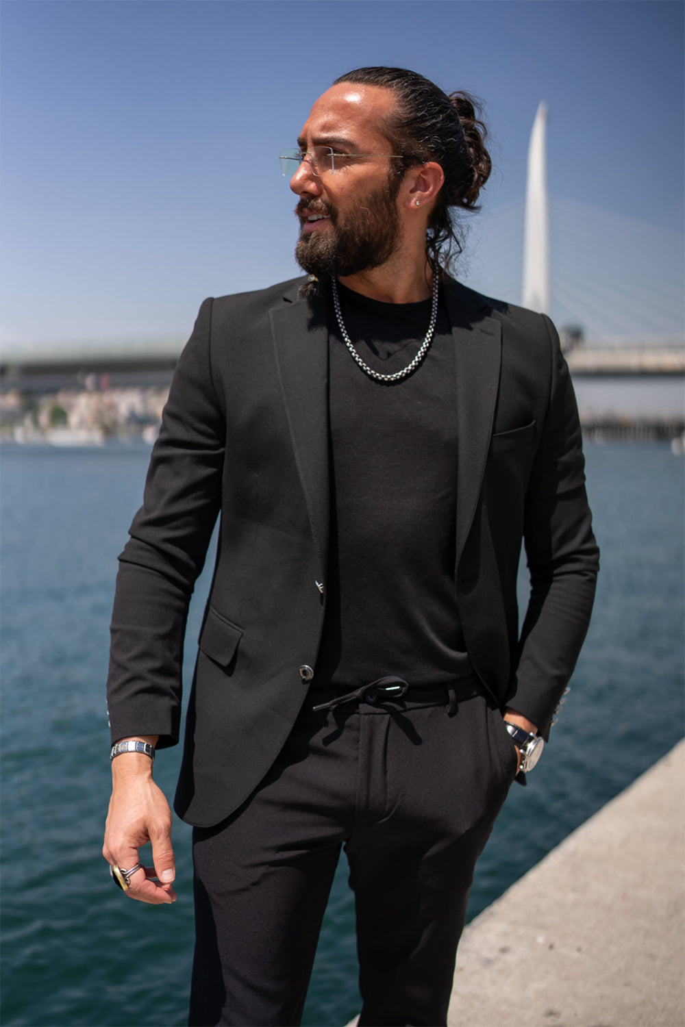 tailored black blazer by Mazonni with sleek silhouette, ideal formal jacket for men with bold urban style