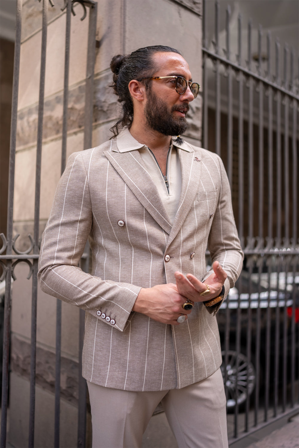 stylish Mazonni double breasted tan blazer for men, paired with polo shirt and sunglasses for chic city look