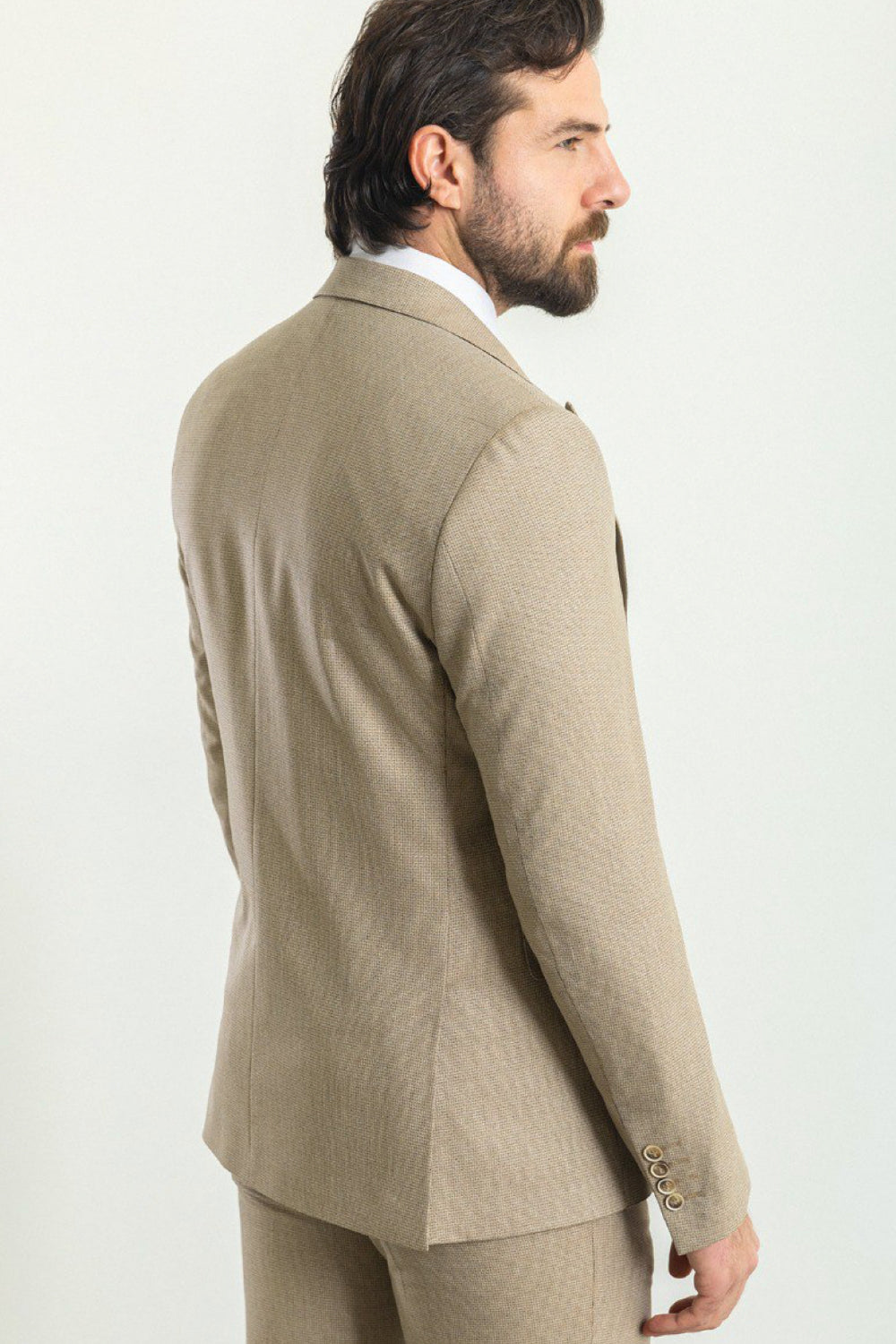 Neutral tone three-piece suit from Mazonni with a stylish pocket square and slim silhouette