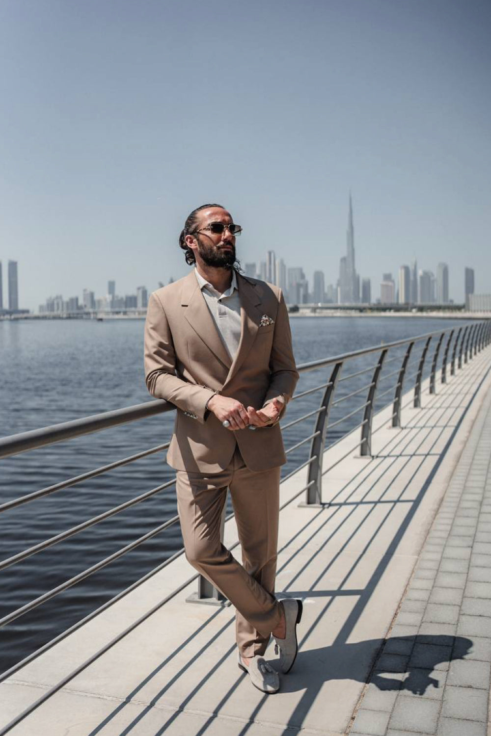 Classic light brown suit for men by Mazonni, paired with a beige shirt and loafers, ideal for city strolls or business casual days