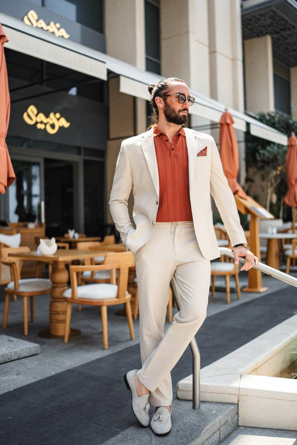 Cream Mazonni men's suit styled with a burnt orange shirt and loafers, perfect for elegant summer dining or rooftop events