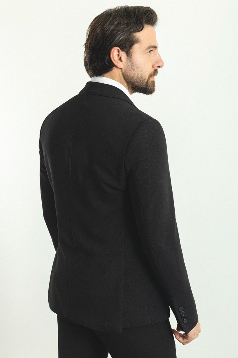 elegant black blazer from Mazonni, minimalist design with structured shoulders and sharp lapels