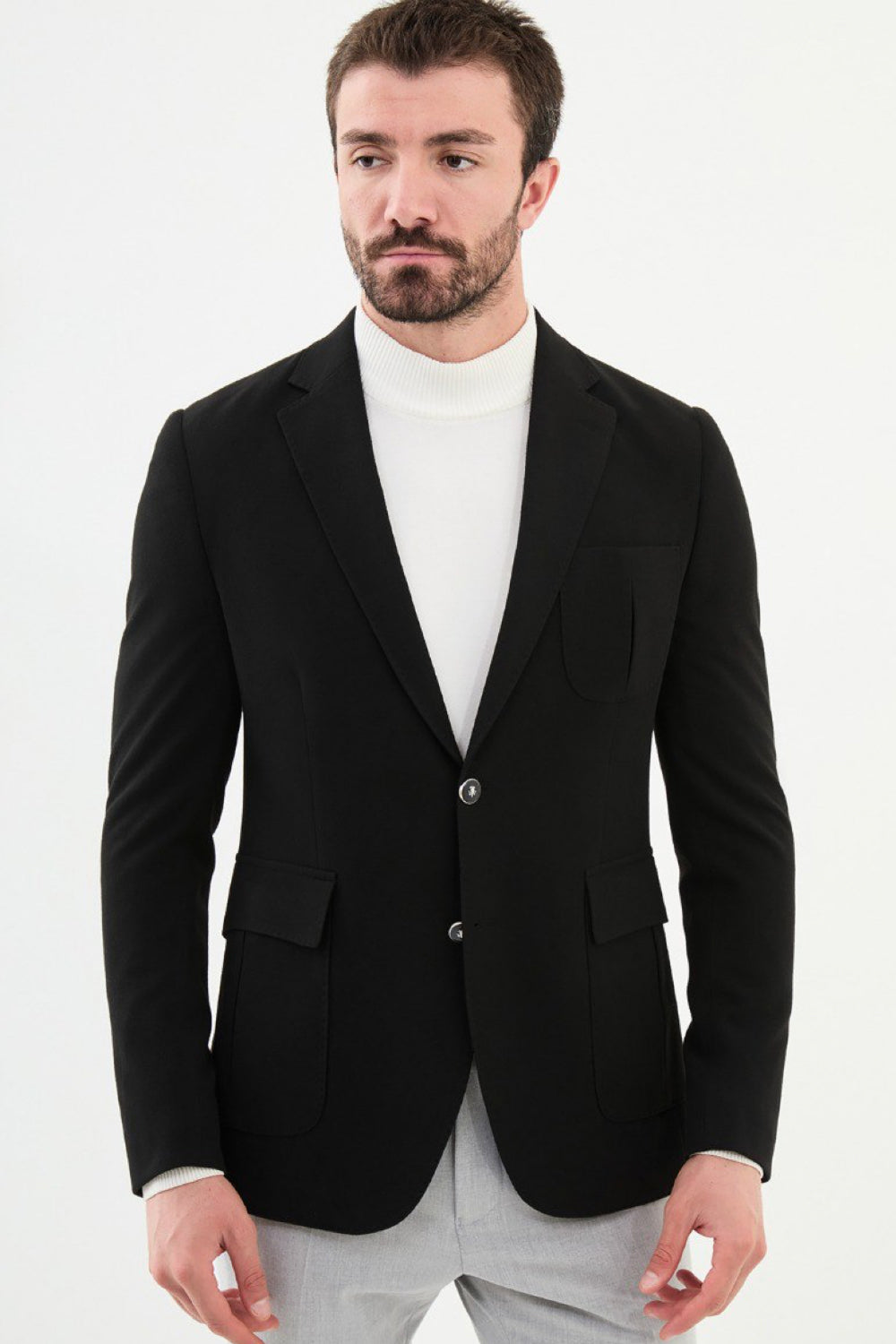 Mazonni black blazer for men styled with light trousers – formal slim-fit blazer for office or events