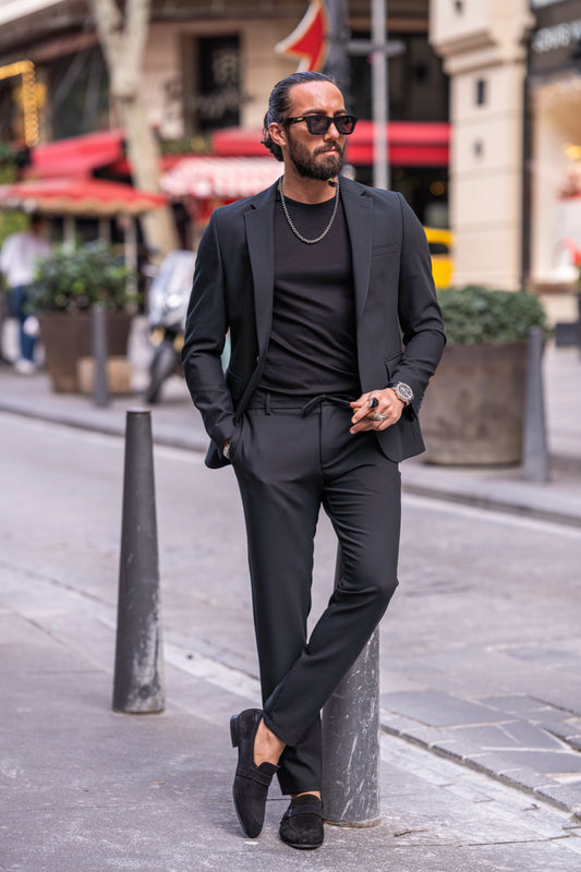 Black casual men's suit by Mazonni styled with black t-shirt and loafers, perfect for smart streetwear looks