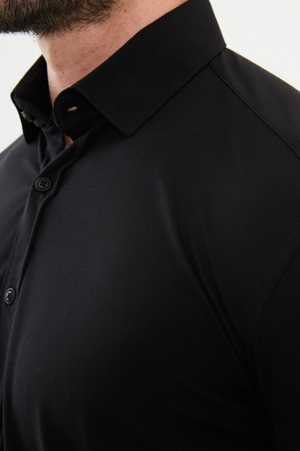 Elegant black button-up shirt by Mazonni made from stretch fabric for comfort