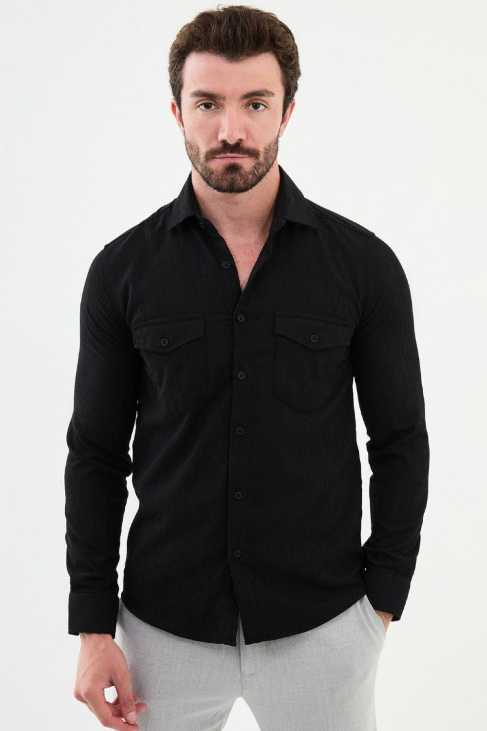 Black utility-style shirt by Mazonni with chest pockets and modern slim fit design