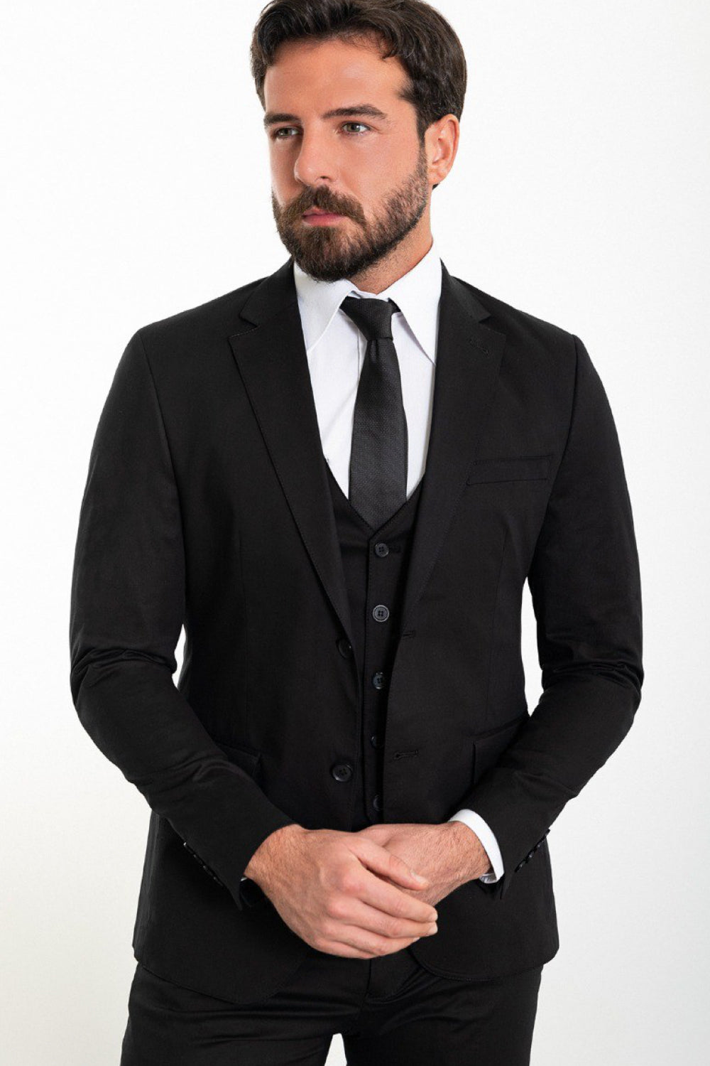 Elegant black tailored suit from Mazonni, featuring a modern silhouette and complete three-piece design