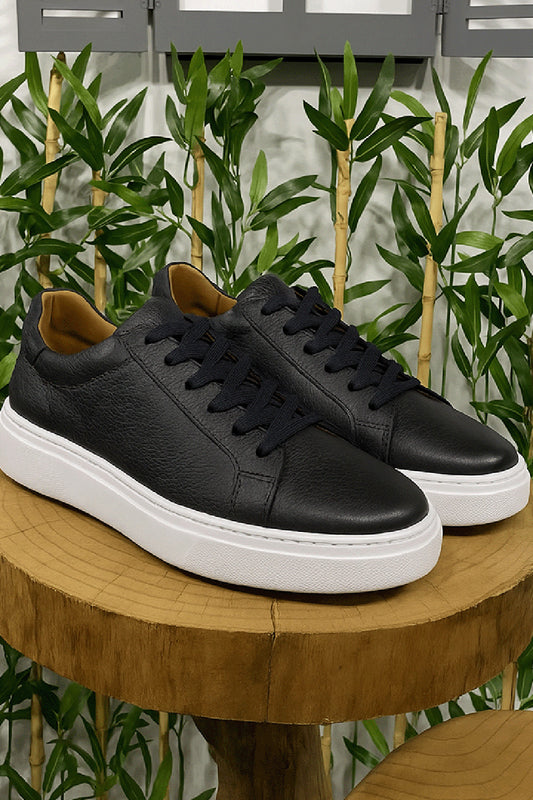 Black leather sneakers for men by Mazonni with contrasting white sole and clean design