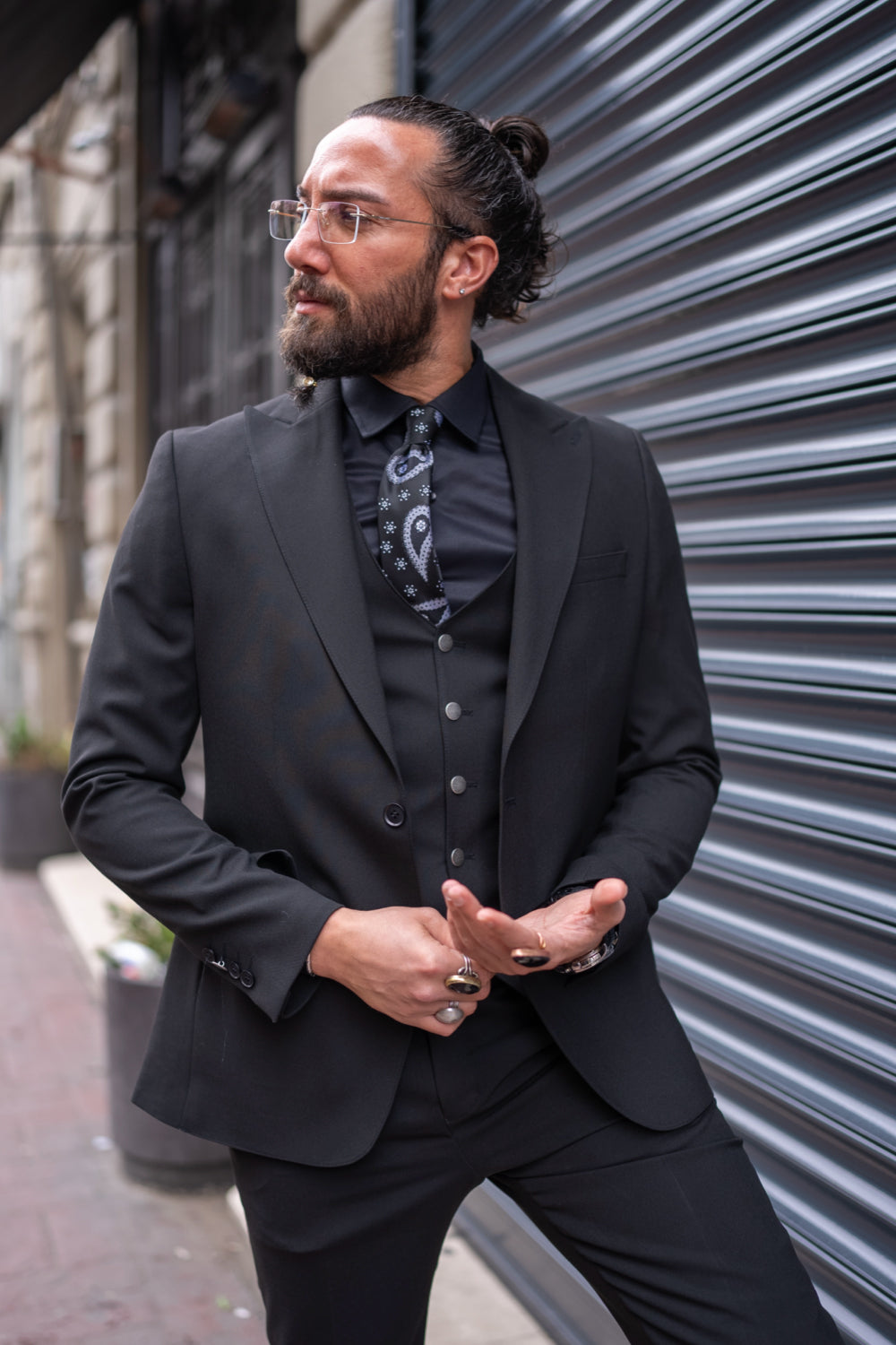 Classic black formal suit by Mazonni with minimalist detailing and a structured silhouette for business and gala occasions