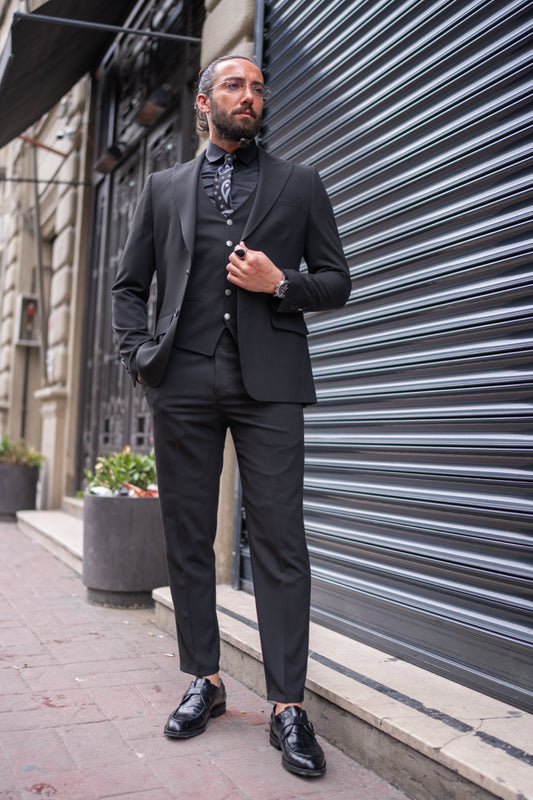 Black slim fit three-piece suit for men by Mazonni with patterned shirt, perfect for formal or evening wear