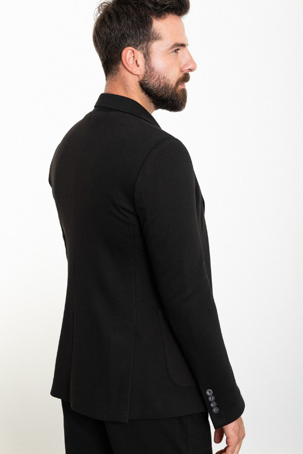 Stylish black blazer and trousers set from Mazonni, featuring sharp tailoring and relaxed white tee