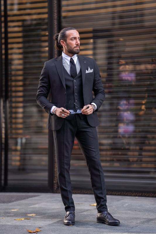 Elegant black men's three-piece suit by Mazonni with jacket, vest, and classic pants for business and formal occasions