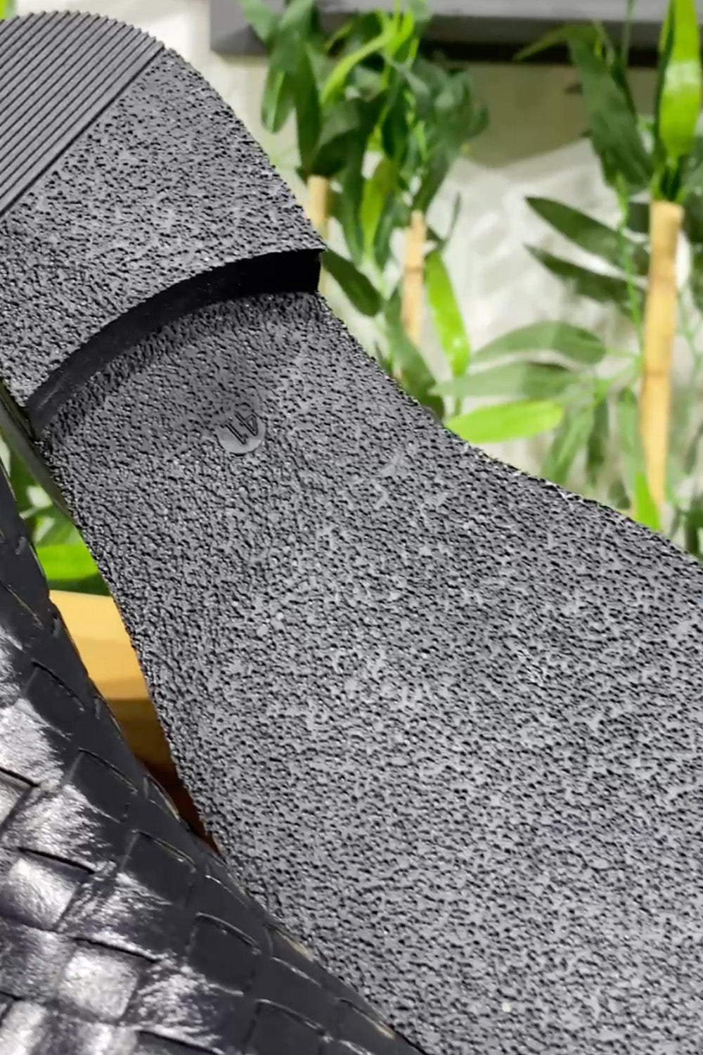 Elegant black high ankle boots by Mazonni featuring detailed handwoven leather sides