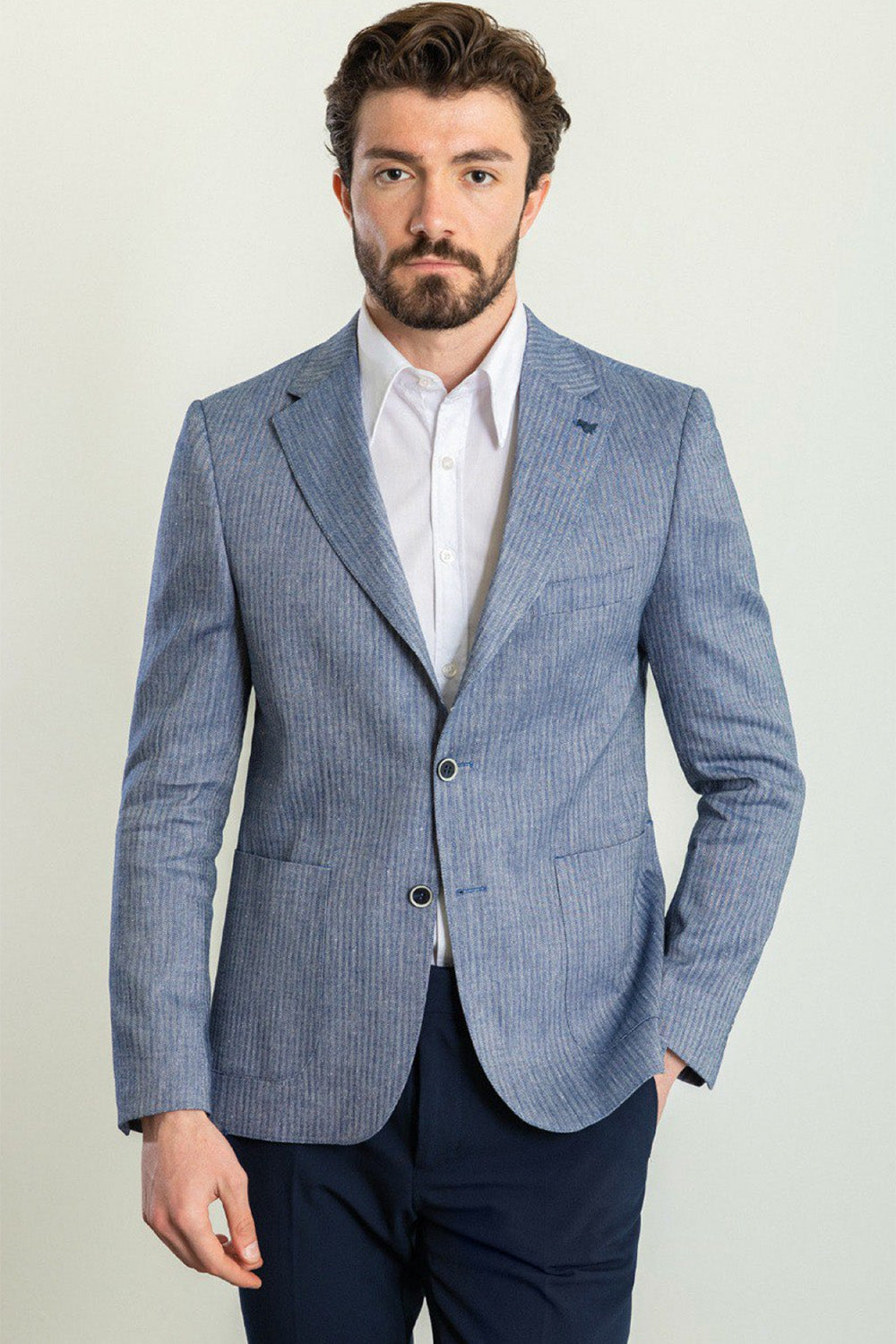 light blue textured blazer for men by Mazonni, paired with white shirt and navy pants for classic smart casual look