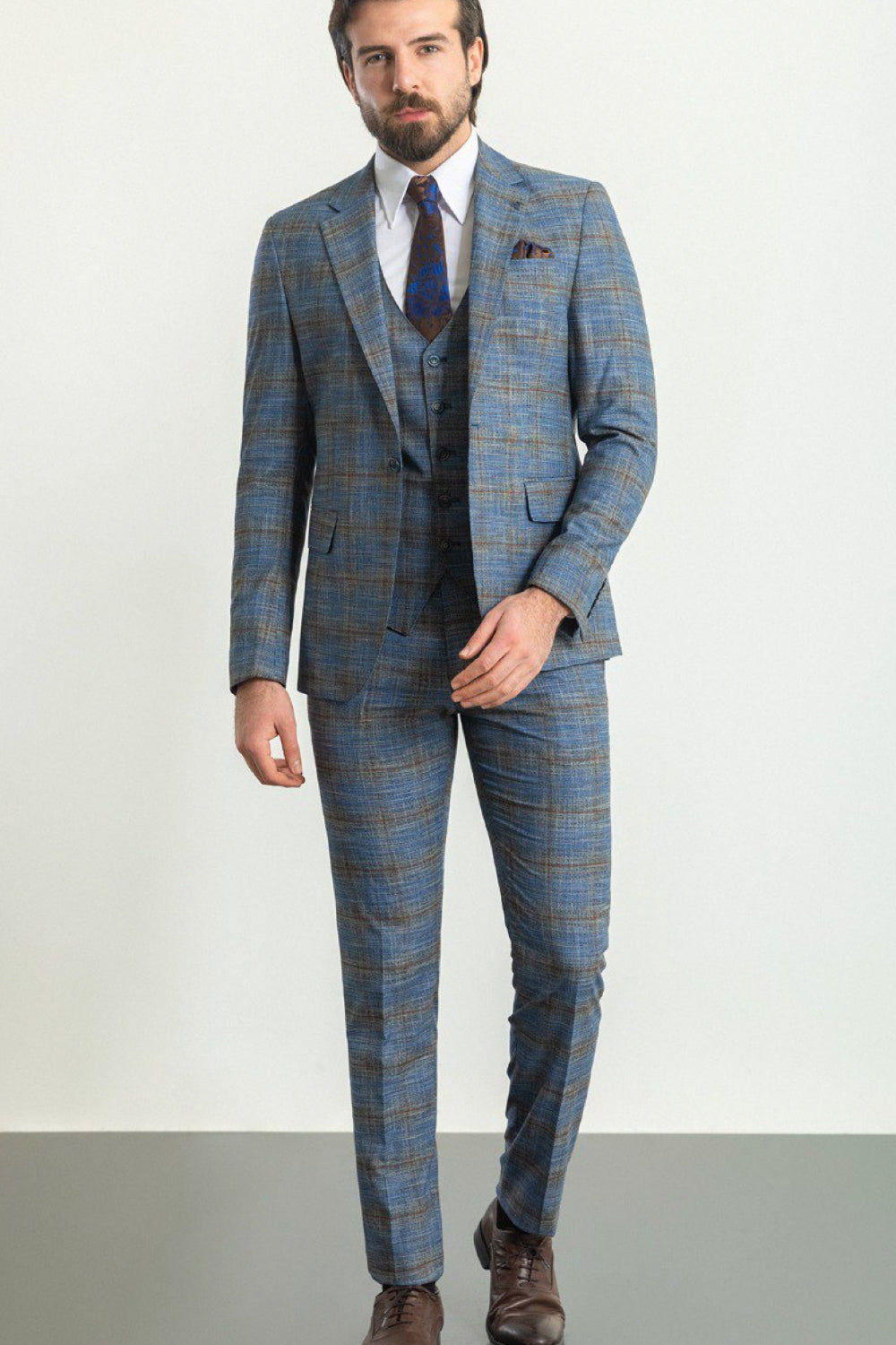 Mazonni men's three-piece suit in blue and brown plaid with matching tie, stylish formal outfit for special occasions
