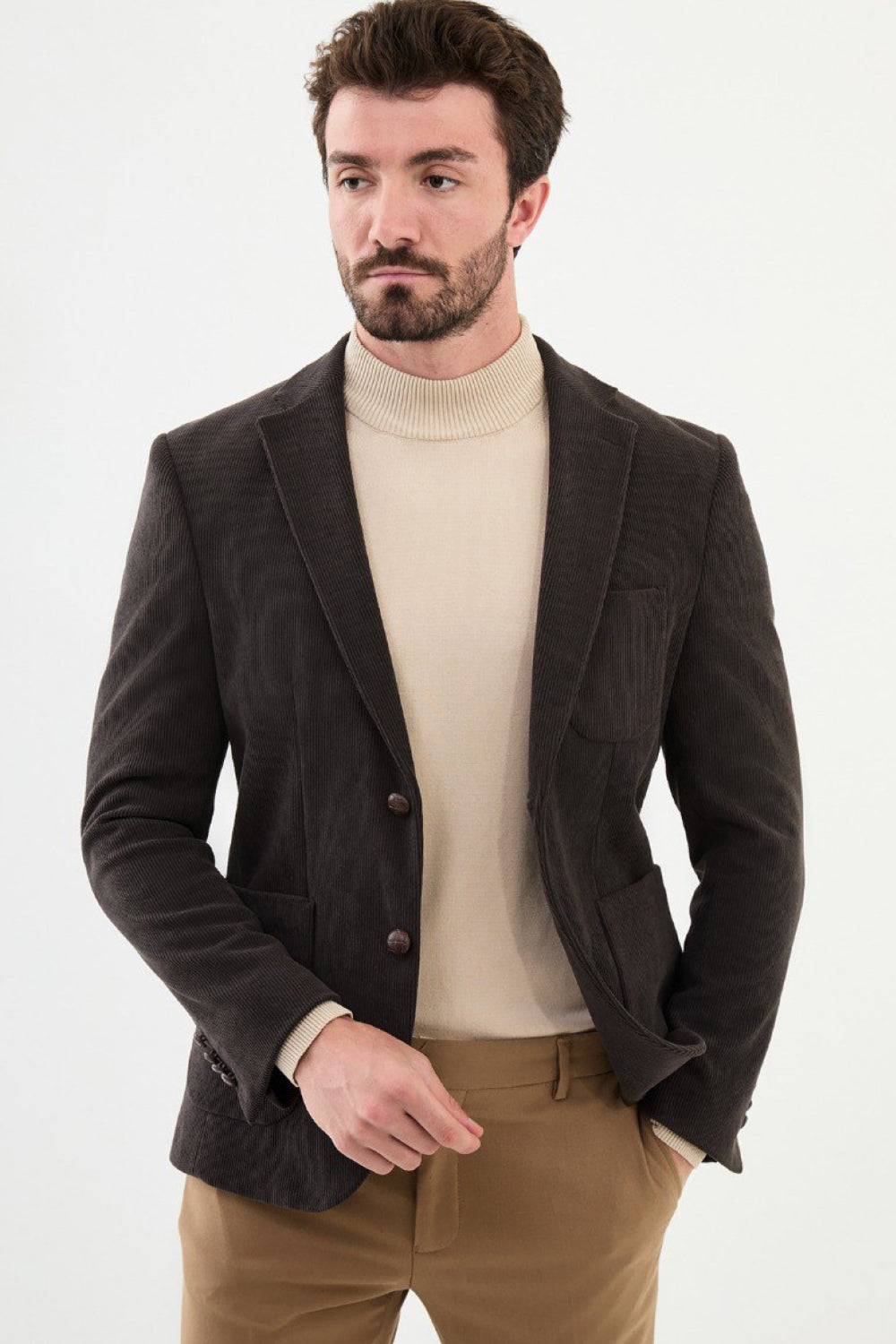 Dark brown textured men’s blazer by Mazonni styled with beige turtleneck – elegant smart casual blazer for men