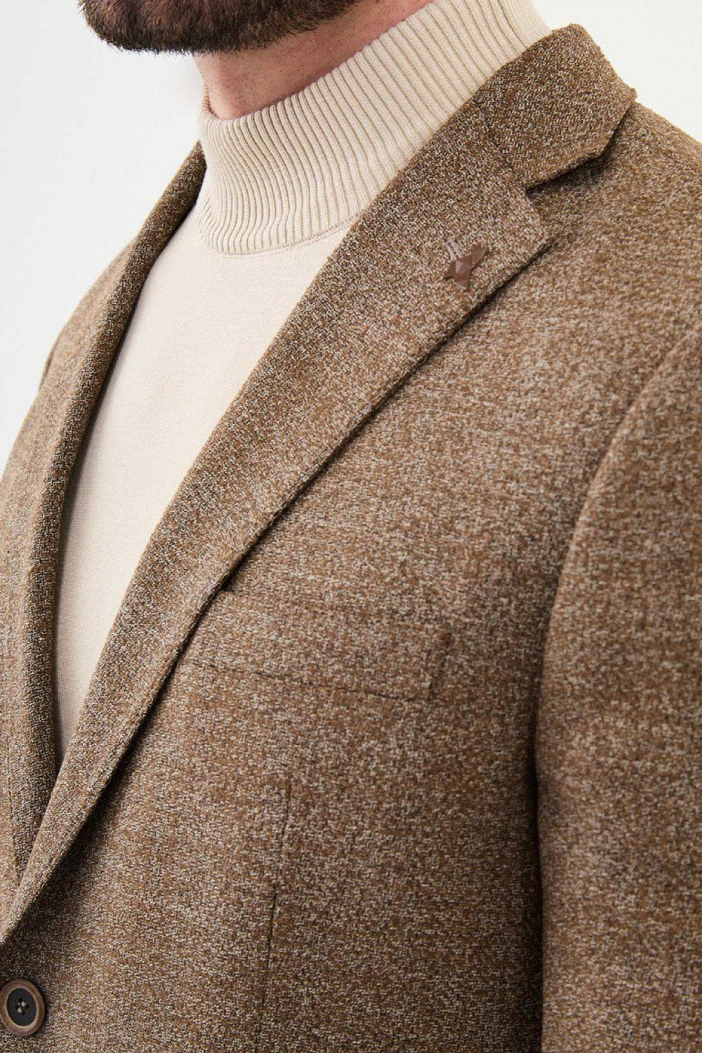 Close-up of textured brown Mazonni blazer showcasing wool fabric and stitching details – autumn winter wardrobe essential