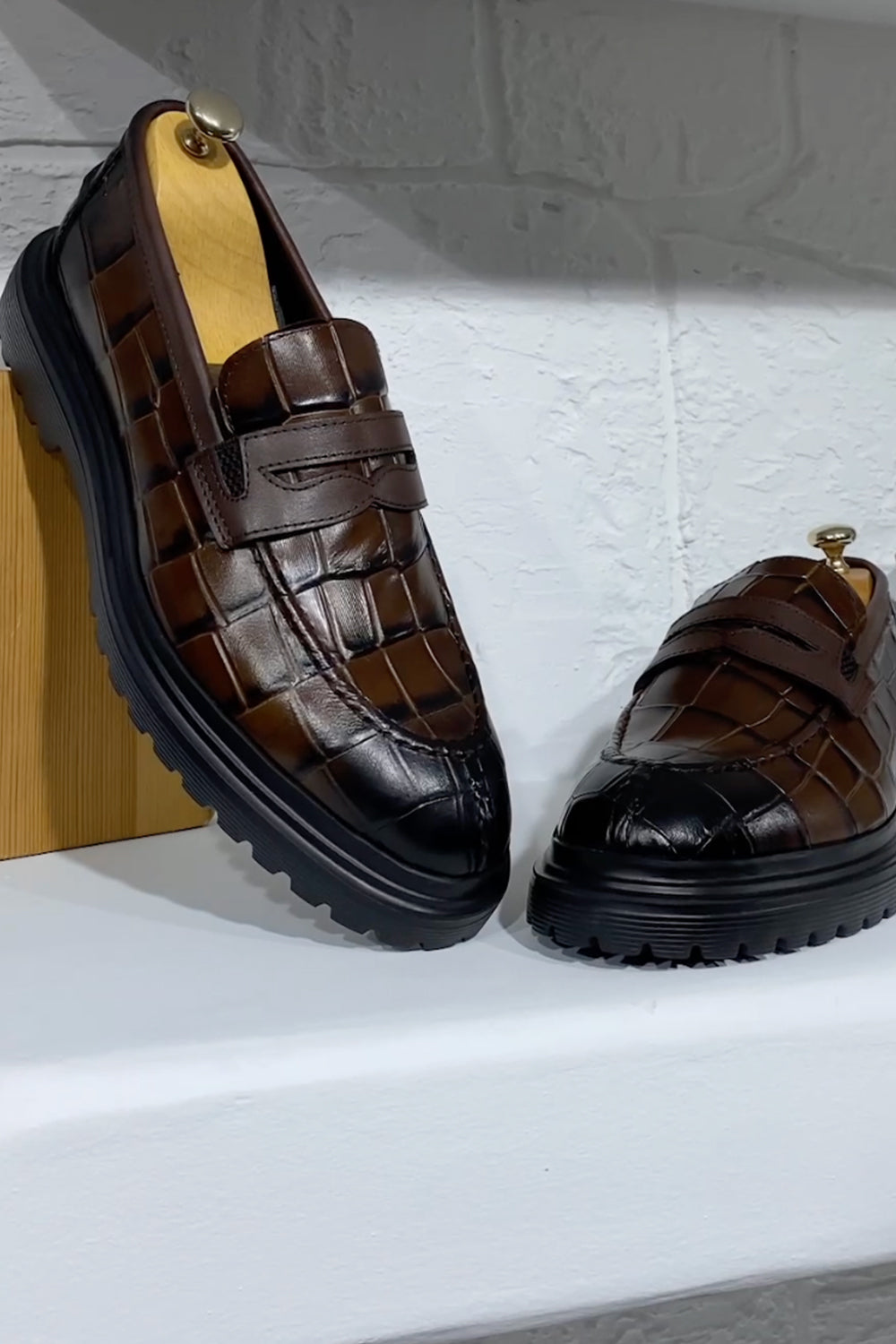 Mazonni brown crocodile-textured loafers with black sole for men