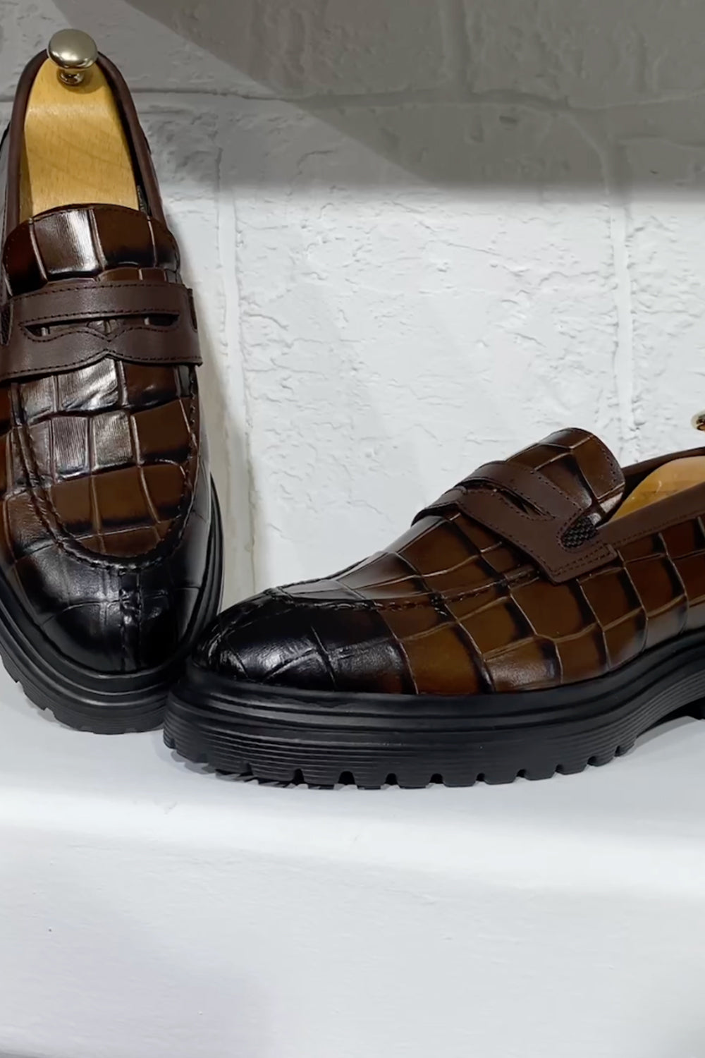 Mazonni brown woven leather loafers with black rubber outsole and rounded toe