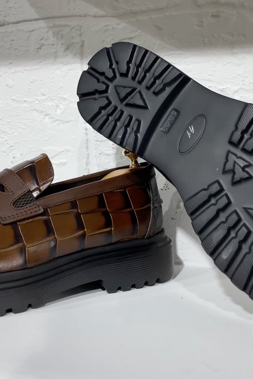 Sole view of Mazonni men’s loafers showing thick treaded bottom and fine stitching