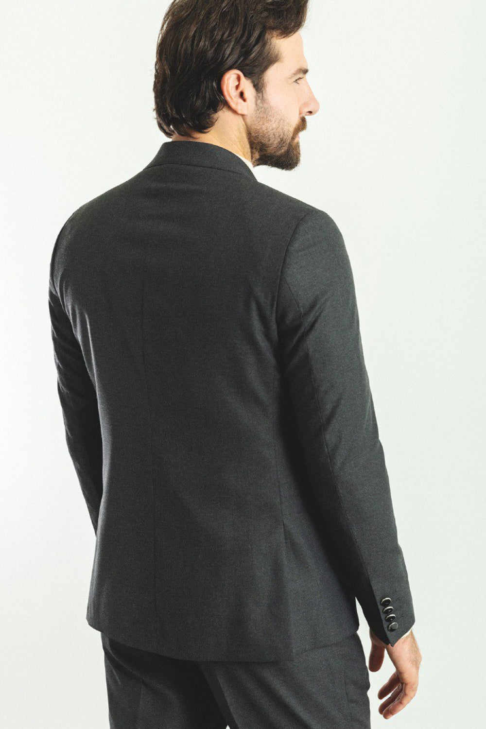Elegant men's charcoal suit from Mazonni, featuring tailored silhouette and refined button details