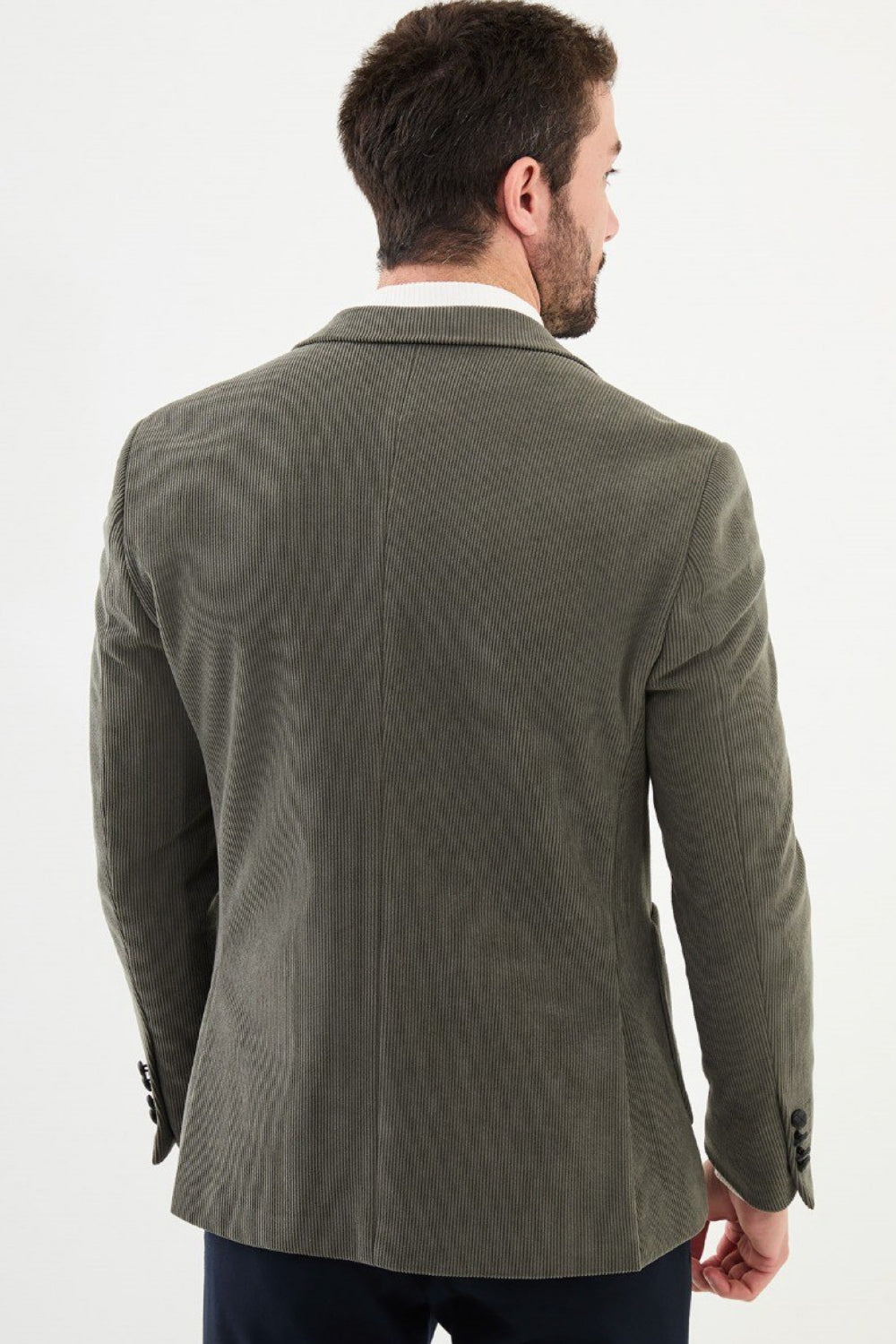 Back view of sage green corduroy blazer by Mazonni showing tailored fit – stylish and versatile men’s fashion blazer