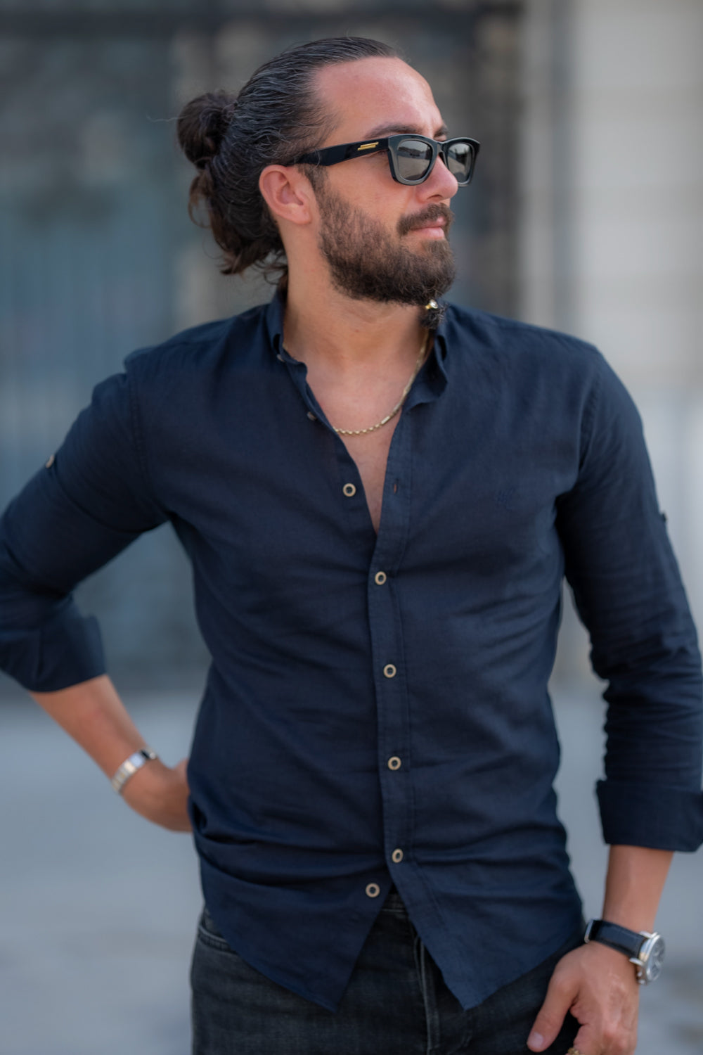 Elegant dark blue button-down shirt by Mazonni paired with black jeans for a sleek look