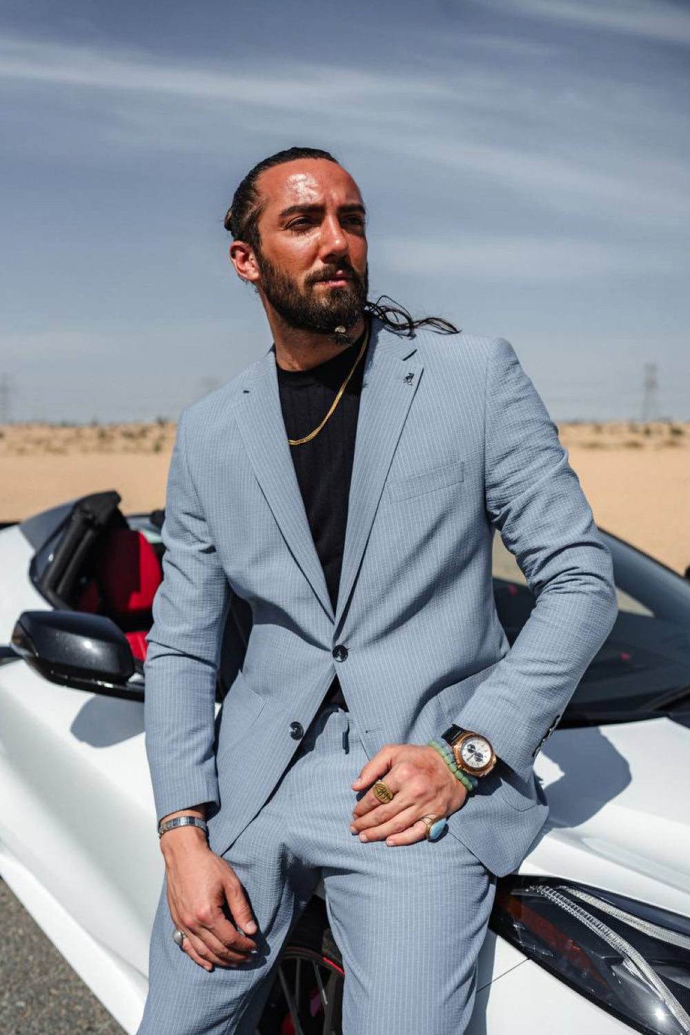 Mazonni sky blue suit for men matched with bold accessories and black base, perfect for a stylish urban look