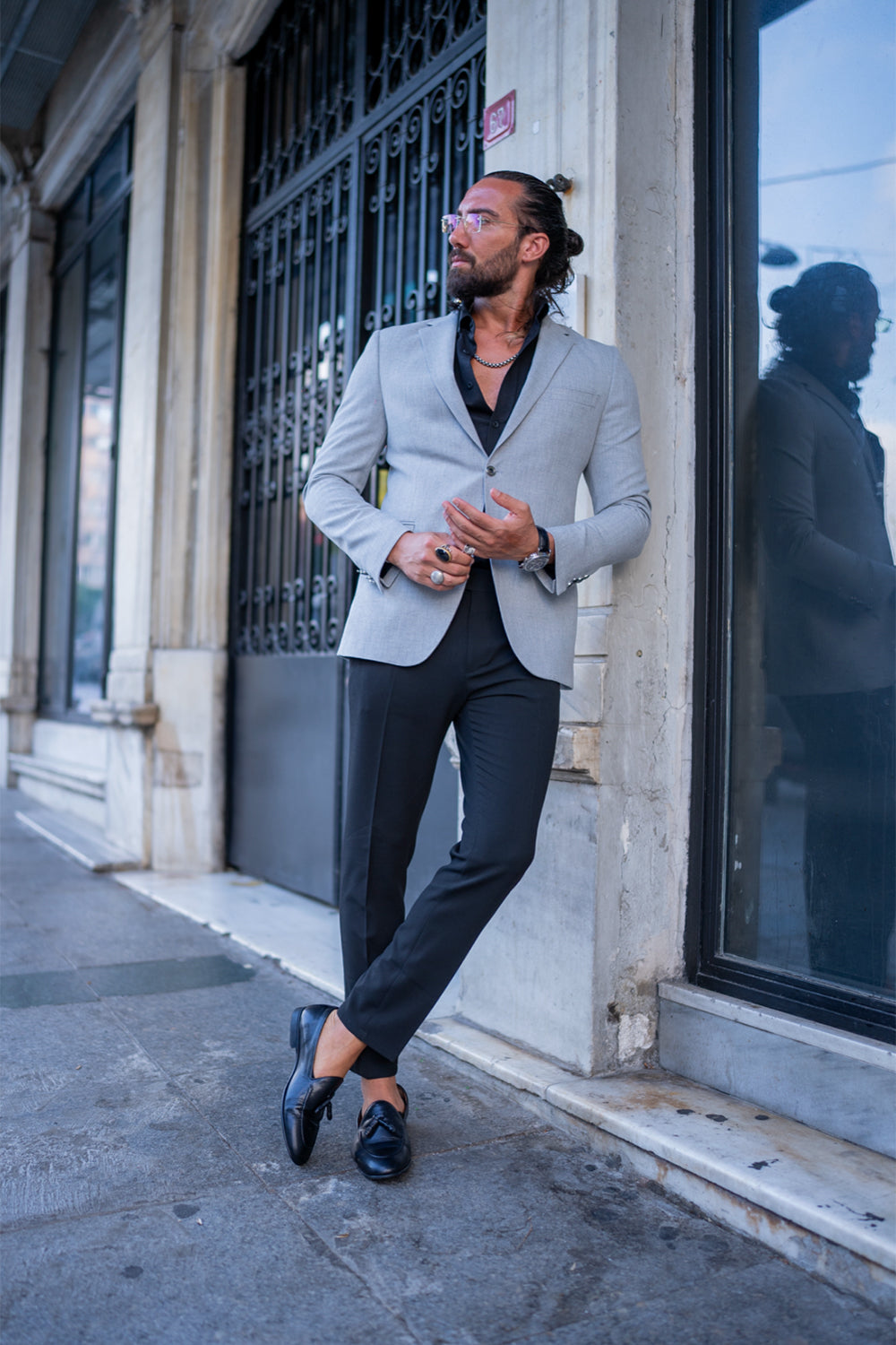 elegant light gray blazer from Mazonni, paired with dark base layer for a bold yet refined city style